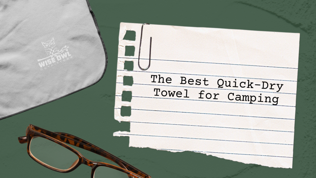 Why Every Camper Needs This Quick-Dry Towel (Even In The Desert) 1 flat lay featuring a gray wise owl outfitters camp towel, a pair of tortoiseshell glasses, and a torn piece of notebook paper with the typed title 'the best quick-dry towel for camping' on a green textured background.
