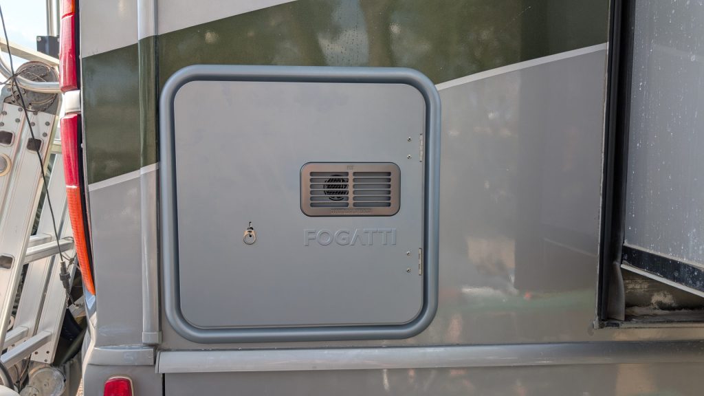 Our Rv Water Heater Failed (Again), So We Went Tankless 2 exterior panel of a tankless water heater